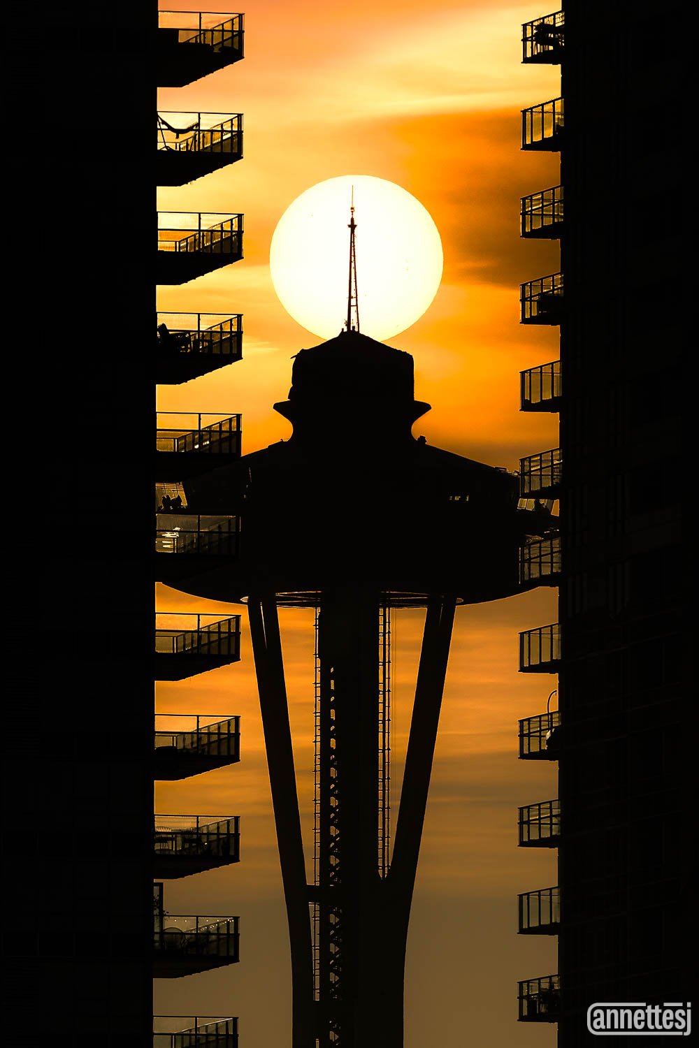 Seattle photography of the Sun aligned with the Space Needle