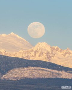 Snow Moon rises over Mount Baker as seen from Anacortes