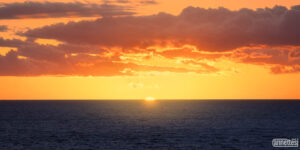 The sun sets on the Pacific Ocean in Hawaii