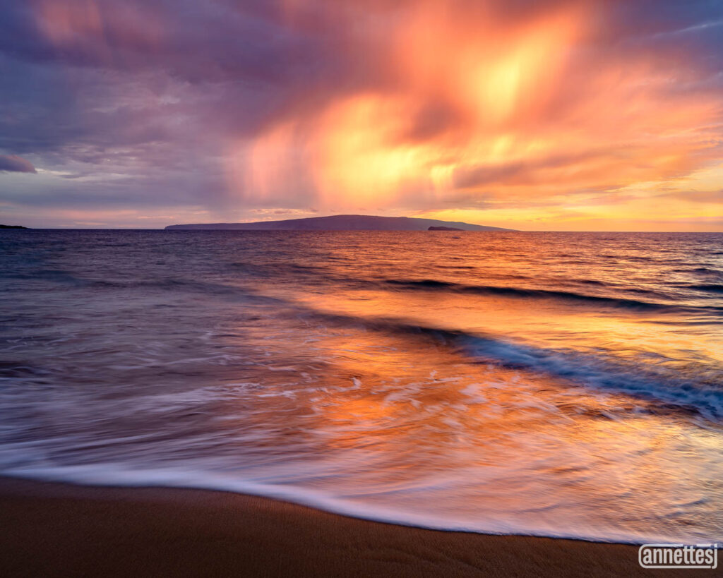 A blazing sunset with virga cloud formations in Hawaii